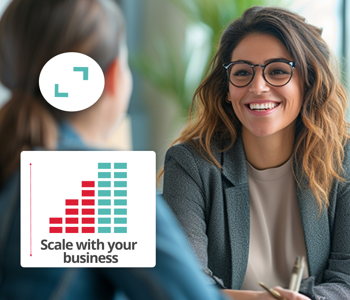 Smiling businesswoman with chart icon representing scalable HR software.
