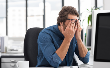 Man frustrated due the disadvantages of the company's old HR Software