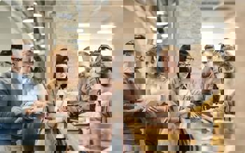 Team discussing plans during coffee