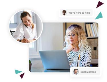 People working in an office with messages on screen saying 'We're here to help' and 'Book a demo