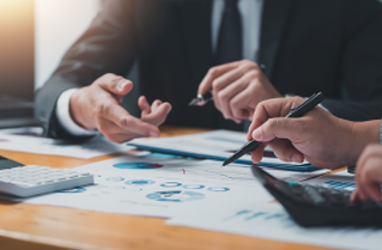 Staff reviewing compliance requirements 