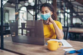person wearing face mask in the office